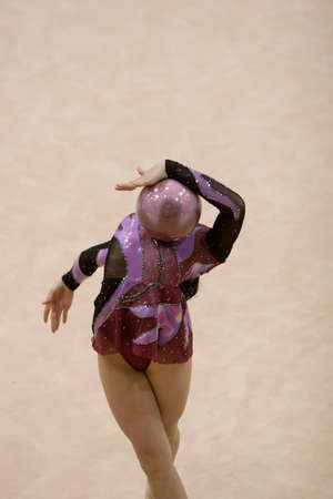 A female competitor in a Rhythmic Gymnastics eventの写真素材