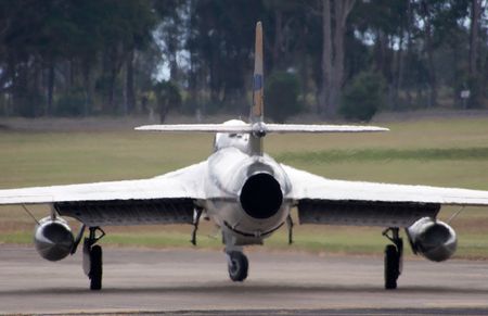 A Hawker Hunter Jet on the runway, with heat haze coming from the jet engineの写真素材