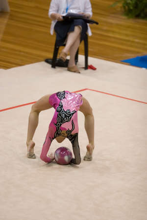 A female competitor in a Rhythmic Gymnastics eventの写真素材