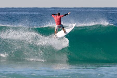 A surfer surfing the waves