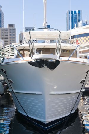 The bow of a luxury boat moored in a marinaの写真素材