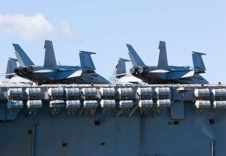 Navy jet fighters on the deck of an aircraft carrierの写真素材