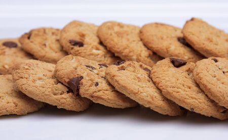 Two rows of cookies laid out on a plateの写真素材