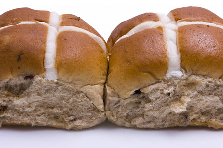 Two Hot Cross Buns against a white backgroundの写真素材