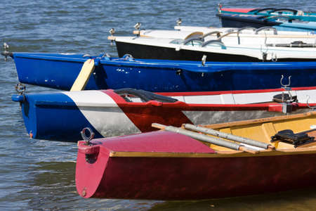 The afts or sterns of surf boats on waterの写真素材