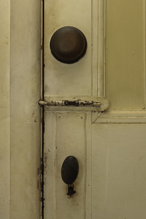 Door with bell, bolt and keyの写真素材