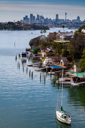 A moored boat on the river with Sydney skyline in the distanceの写真素材