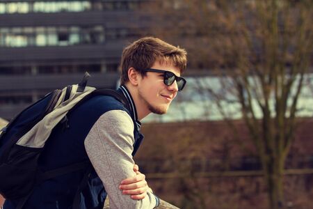 Smiling young student relaxing.Thinking student,Relaxing,Outdoors.Park.の写真素材
