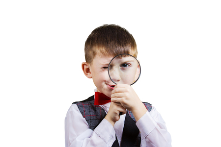 Curious Exploring little boy with magnifying glassの写真素材