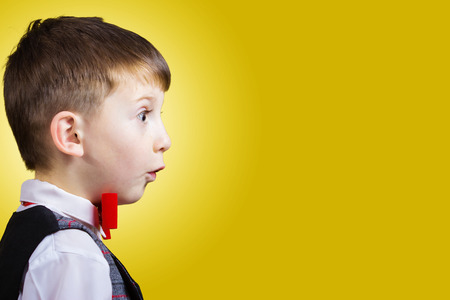 Excited, Surprised little boy profile portraitの写真素材