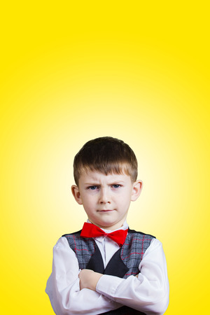 SeriousStubbornsadupset  little boychild  isolated over grey background.Facial expressionの写真素材