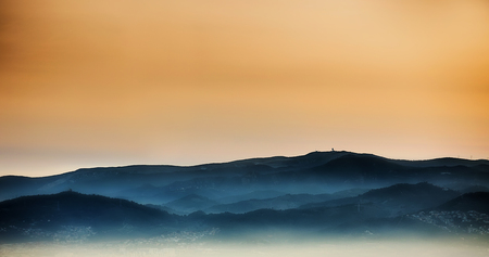 Sunset silhouette of hills in spain.の写真素材