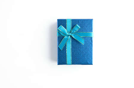 gift box with blue ribbon for Christmas, New Year, birthday on white backgroundの写真素材