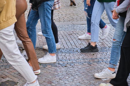 Low Section Of People pedestrians Walking On pavement Sidewalk old city centerの写真素材