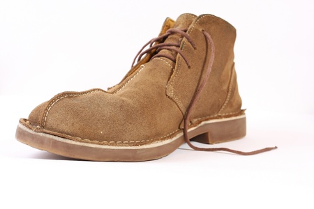 Old leather boot on white background 