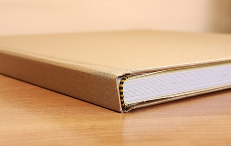 Book detail on wood table の写真素材
