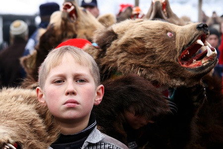 Boy dressed in bear skin at the Bear dance parade in eastern Romania.The festival  take place every winter in December 30. のeditorial素材