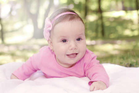 Smiling baby in natureの写真素材