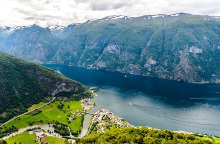 Beautiful amazing aerial panorama view on landscape of Aurlandsfjord with mountains, clouds, cloudy sky nearby Flam, Aurlandsvangen, Stegastein. Scandinavia. Norway.の写真素材