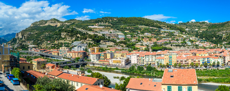 VENTIMIGLIA, Italy- August 17 2014: View on the city, town, mountains with blue sky, italian riviera. Border with France, Cote de Azur.のeditorial素材