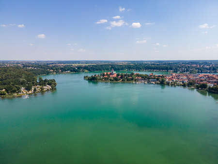 Idyllic aerial panorama view on Ratzenburger See. Lake with boats, sailboats, blue sky. Schleswig Holstein, Ratzenburg, Germanyの写真素材