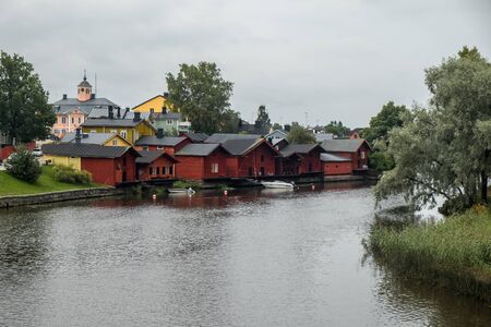 Red houses. Finnish warehouses in the city of Porvoo. A cozy atmospheric town.の写真素材