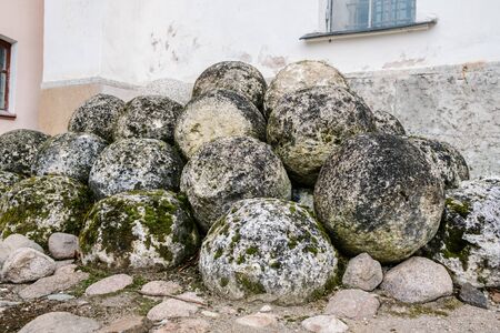 Acient stone cannonballs near the fortress wallの写真素材