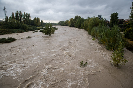 flooded river with sand and water splashes, natural disasterの写真素材
