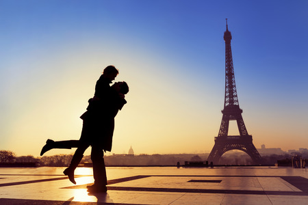 Silhouette of young couple in love with Eiffel Tower background in Paris, Franceの写真素材