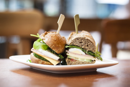 Delicious fresh sandwich waiting for its hungry owner in a welcoming coffee shopの写真素材