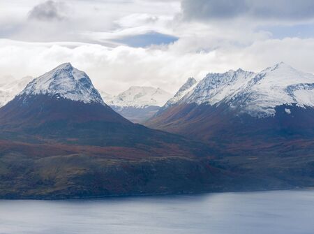Beautiful landscape of snowcap mountains with autumn colors near Ushuaia, Argentina, South Americaの写真素材