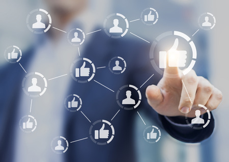 Person touching like buttons connected together. Concept about marketing, reputation management and social media networkingの写真素材