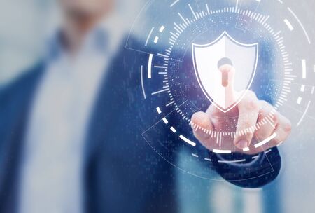 Cybersecurity of digital network systems with computer security engineer touching shield icon. Information technology protected with firewall, secure access and encryption against cyber attacksの写真素材