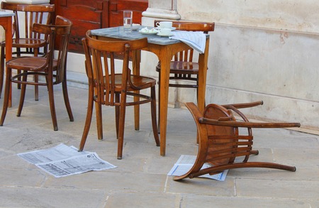 chairs and table in front of the barの写真素材
