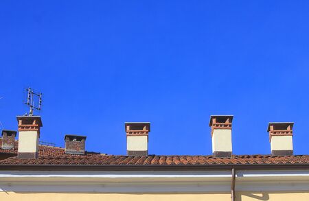 some chimneys on the roofの写真素材