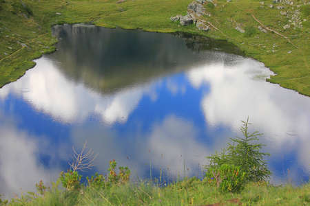 panorama with mountain reflections in the lakeの写真素材