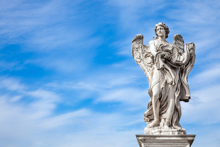 Angel statue along SantAngelo bridge in Rome. the bridge leading to Rome Castel SantAngelo is adorned with ten beautiful Baroque statues of angelsの写真素材