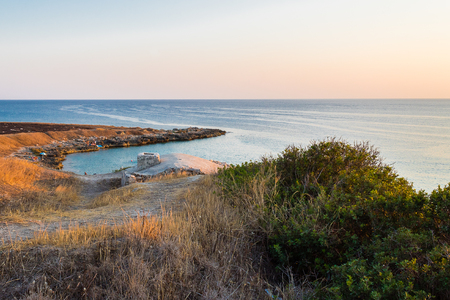 Guard station at sunset by the sea in Italyの写真素材