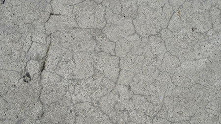 Texture and background for the material. Unique crack pattern on asphalt