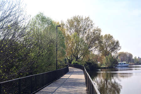Passageway over a lake in a park on a sunny day