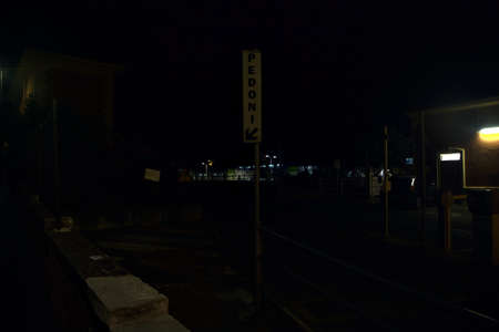 Entrance of a parking with sign at nightの写真素材