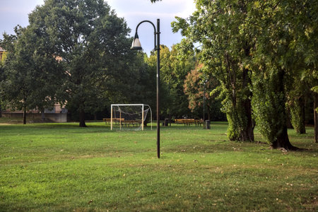 Football score on the lawn in a park at sunsetの写真素材