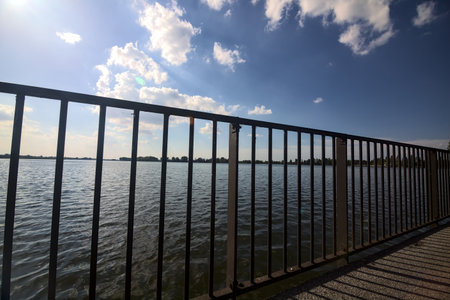 Bridge over a lake on a sunny dayの写真素材