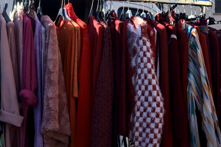 Woman dresses on a rack in a stall seen up closeの写真素材