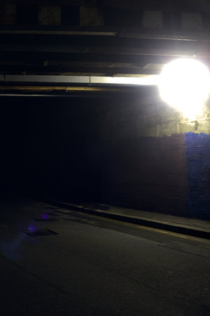 Underpass and pavement in an italian city at nightの写真素材