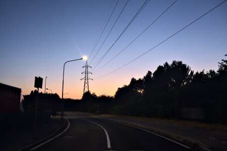 Road in the outskirts of a village in the italian countryside at duskの写真素材
