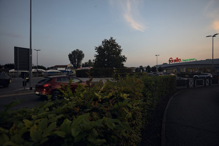 Mantua, Italy - October 2023 - Superstore seen from the entrance of it at sunsetのeditorial素材
