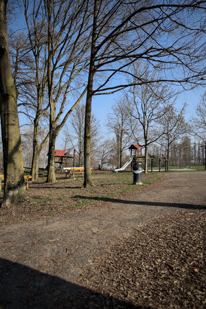 Empty playground in a park by the riverside on a sunny day