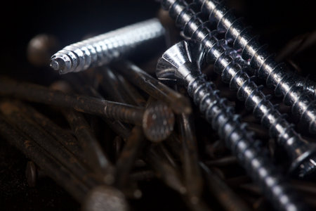 Screws on black background seen up closeの写真素材