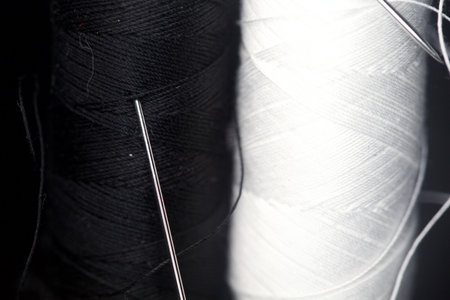 Sewing thread on a black background seen up close